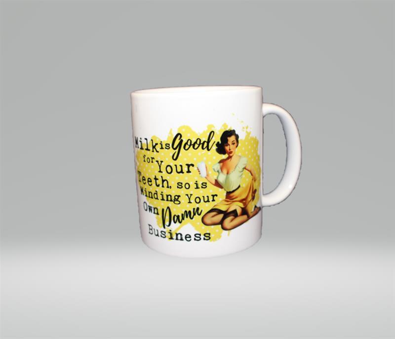 MILK IS GOOD FOR YOUR TEETH.  SO IS MINDING YOUR OWN DAMN BUSINESS MUG